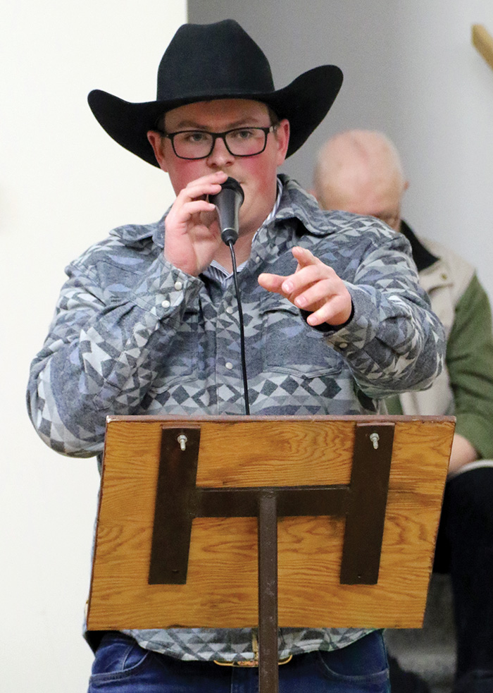 Ty Cutler auctioning off pies.<br />